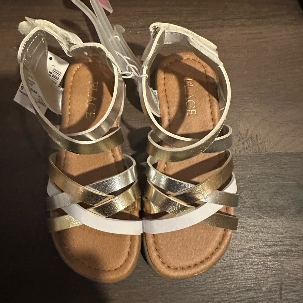 For sale are toddler girls sandals in white, gold, silver and bronze $20
